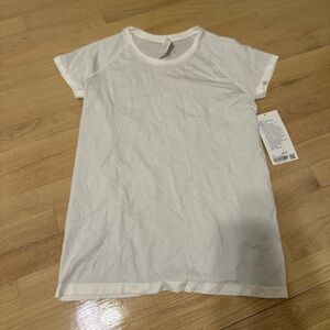 Brand new Lululemon white swiftly tech shirt sleeve 2.0. Women size 10.